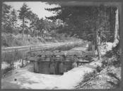 Carreira de tiro junto a curso de água.